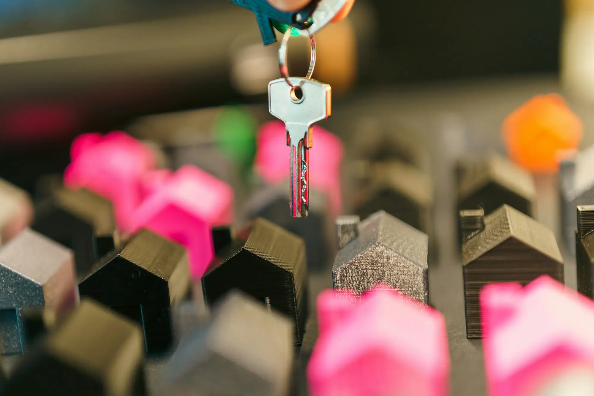 Keys and signed contract documents on a table at a property settlement
