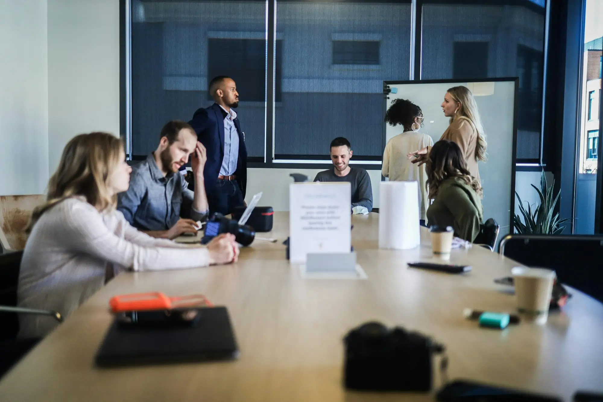 Small business team gathered around a table working through an urgent plan